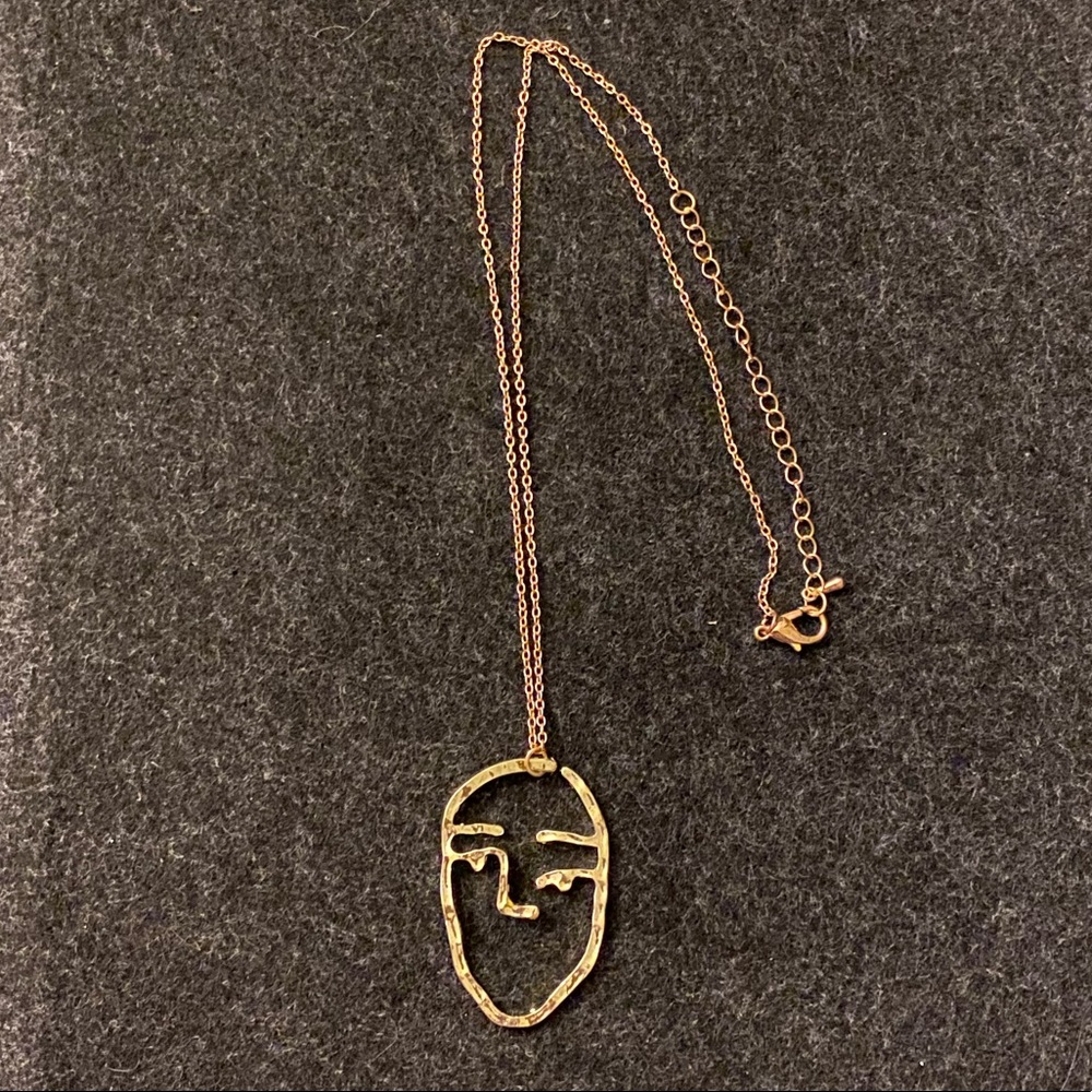 Abstract face necklace